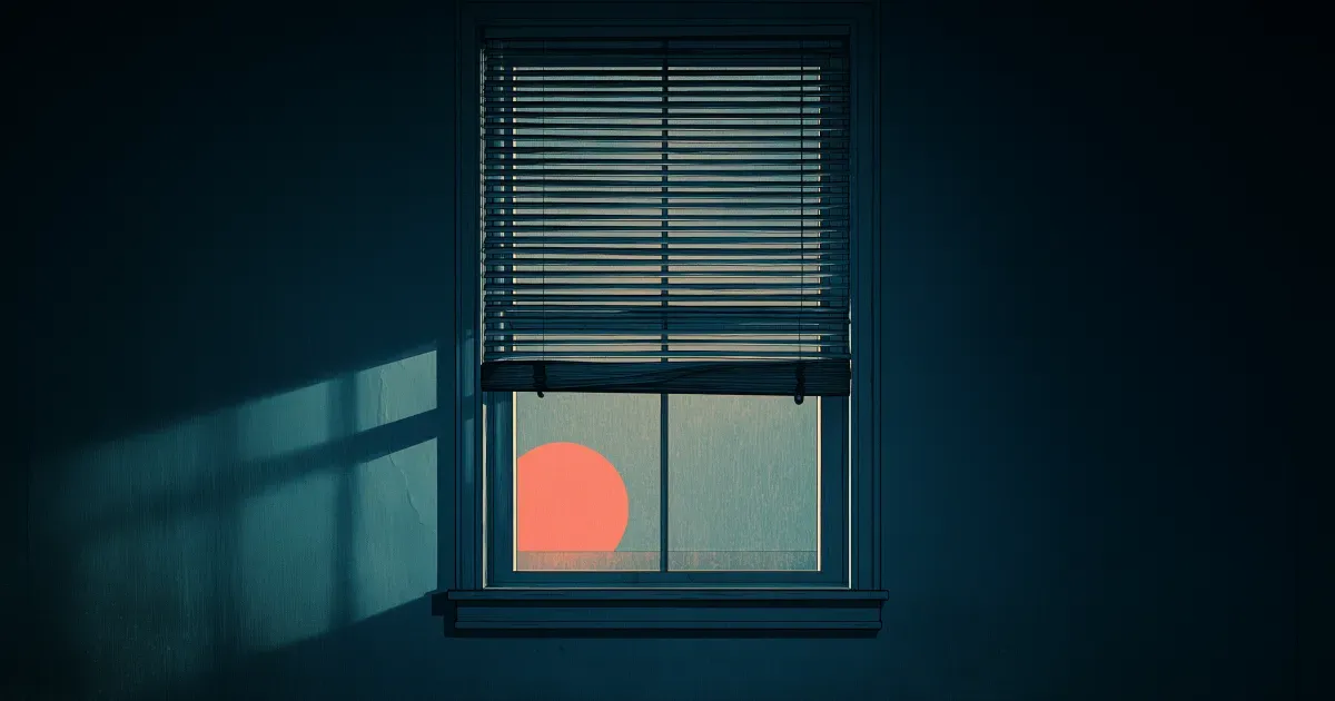 Window blinds in a dark room, halfway down, with a setting sun visible. 
