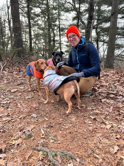 Zelda and I with her two best friends Freyja and Loki. She is the hound dog on the left in the orange jacket. I am the human